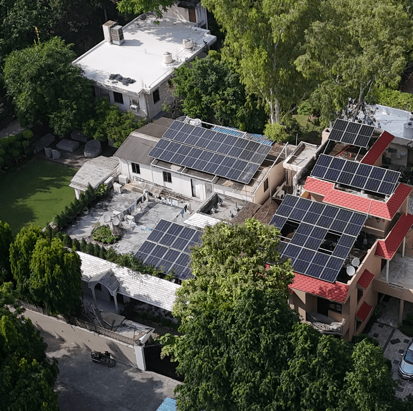 Aerial view of a residential neighbourhood with multiple rooftop solar installations
